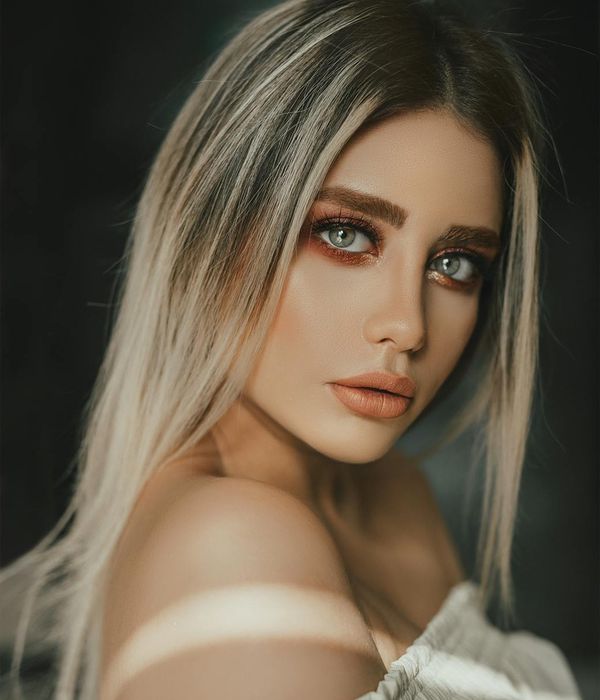 Woman with calm expression focusing her eyes peacefully.